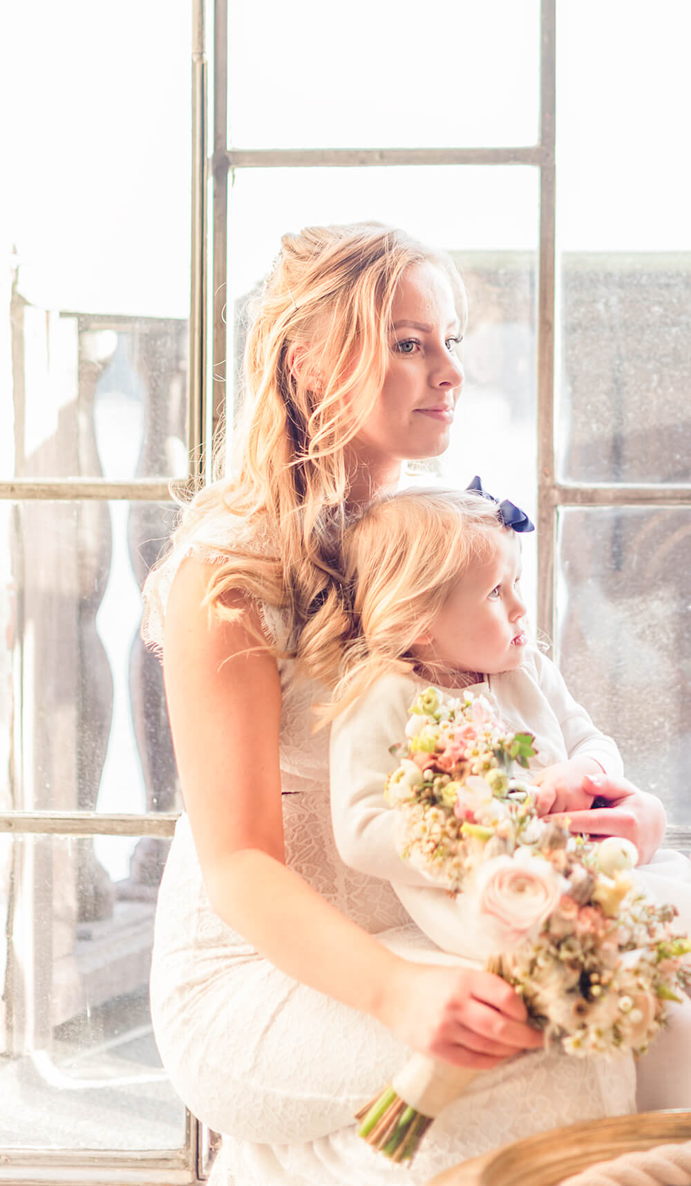 Bride and flower girl with matching wedding bouquets