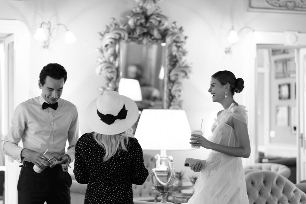Bride and groom and makeup artist getting ready for intimate elopement ceremony at the Grand Hotel Tremezzo 